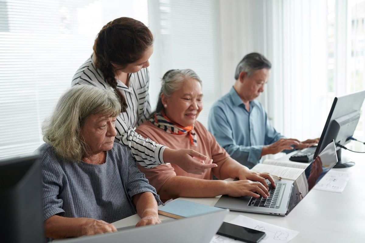 Senior woman learning computer skills